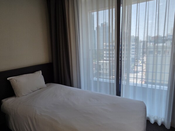 Family Room, Balcony, City View | Free WiFi