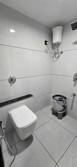 Comfort Triple Room | Bathroom | Slippers, towels, soap, shampoo - hotel A-one (Gandhinagar)