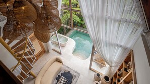 A modern bathroom with a large window, a bathtub, and a small pool. - Govala Usada Ubud Villa (Tegallalang)