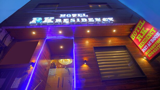 A hotel entrance with a neon sign reading "HOTEL RESIDENCY." -  Hotel RK Residency Opposite ISBT Sector 43 Chandigarh (Chandigarh)