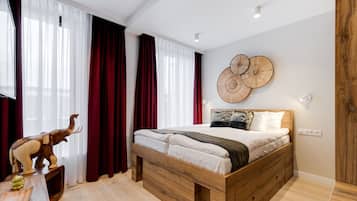 Deluxe Suite, 2 Bedrooms, Garden View | In-room safe, blackout drapes, iron/ironing board, free WiFi