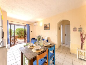 Apartment, 1 Bedroom | Dining room - Relax on the Bay of Marinella (Golfo Aranci)