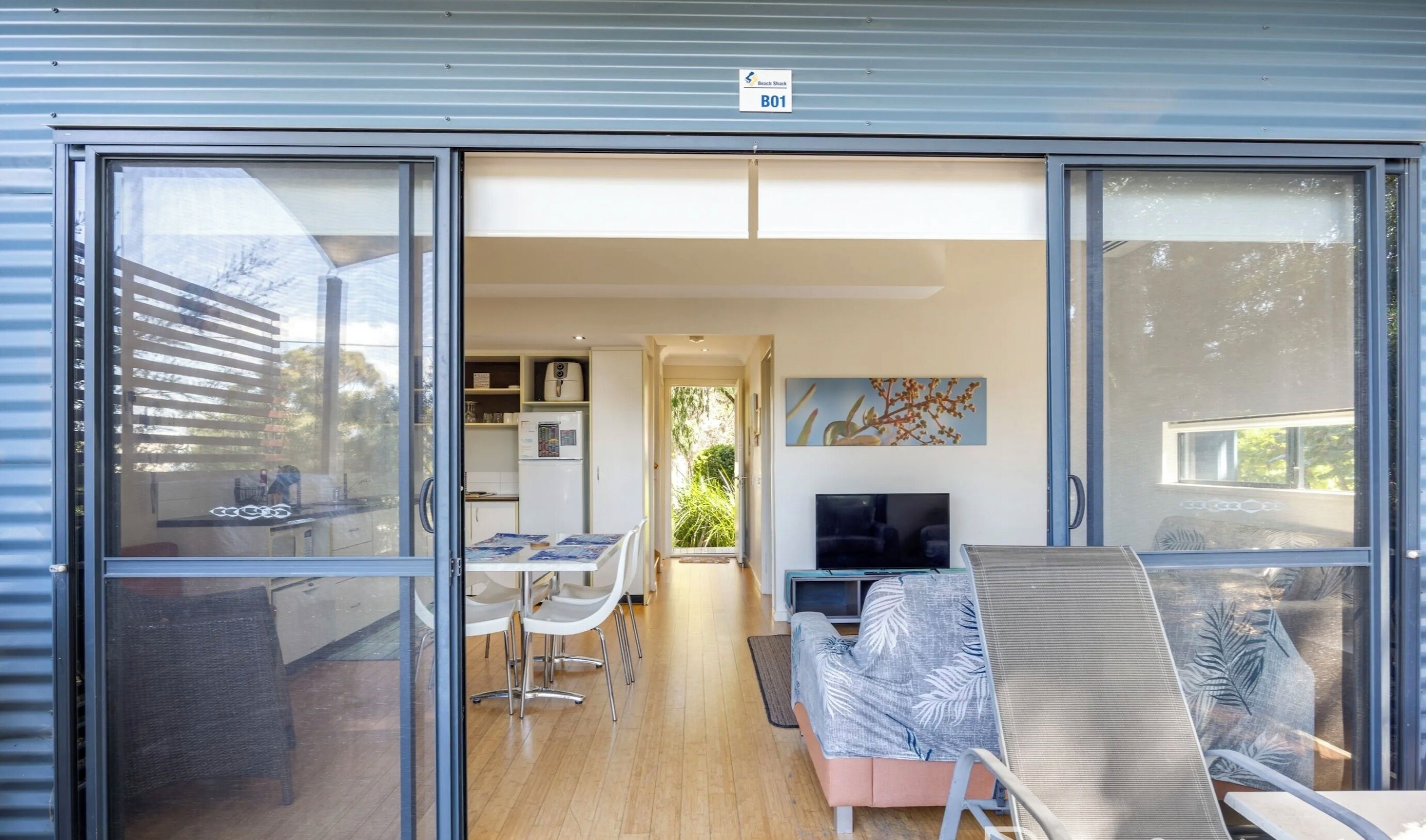 A modern interior with a kitchen, dining area, and living space.