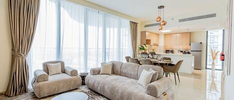 Luxury Apartment, Balcony, City View | Living area | 65-inch Smart TV with digital channels, Netflix, streaming services