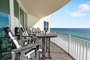 Outdoor dining - Aqua 1201 | 3 BR/3 BA Gulf-Front Corner Unit | VIP Beach Chairs Included (Panama City Beach)