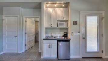 Fridge, microwave, coffee/tea maker, cookware/dishes/utensils