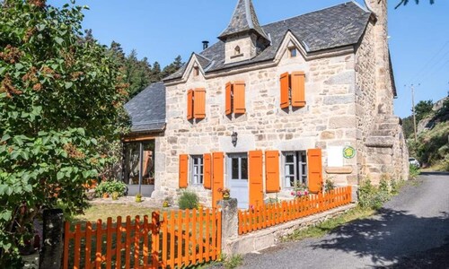 Cottage in Aubrac by Rimeize River