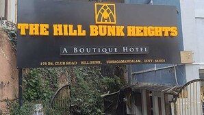 A sign for The Hill Bunk Heights, a boutique hotel, with its address and contact number. - THE HILL BUNK HEIGHTS OOTY (Ooty)