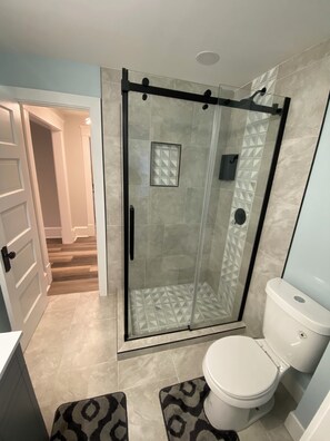 Shower, hair dryer, towels, soap