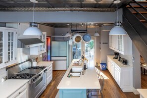 A modern kitchen with stainless steel appliances, white cabinetry, and pendant lighting. - Your Luxury Private Telluride Getaway – Steps from Main Street & the Gondola (Telluride)
