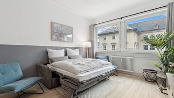 Apartment, City View | Living area | Toys, computer monitors