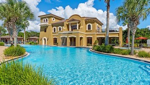 A large, two-story building with a swimming pool in front. - 5 Bedroom • 4.5 Bath • Sleeps 10 • Gulf-Front • Includes 1 Complimentary Beach S (Santa Rosa Beach)