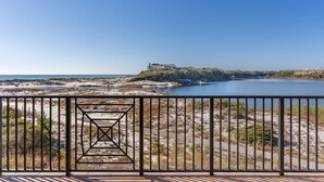A coastal view with a clear sky, a sandy beach, and a body of water. - 5 Bedroom • 4.5 Bath • Sleeps 10 • Gulf-Front • Includes 1 Complimentary Beach S (Santa Rosa Beach)