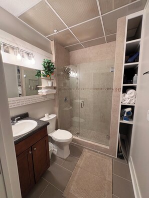 Shower, hair dryer, towels, soap