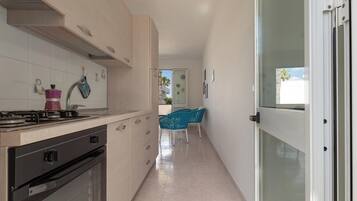 Fridge, stovetop, coffee/tea maker, cookware/dishes/utensils