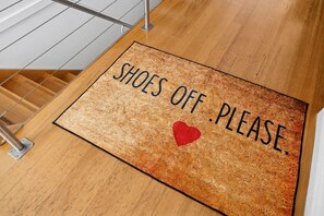 A doormat with the text 'SHOES OFF. PLEASE.' and a red heart symbol. - Blue Datcha (Aireys Inlet)