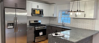 Modern 4-bedroom townhome in lovely Jamaica with cool AC