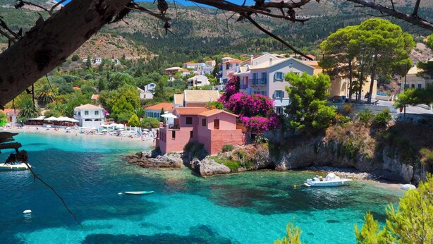A coastal town with clear turquoise waters, a beach, and colorful buildings. - Anesis - Three Bedroom Villa, Sleeps 6 (Fiskardo)