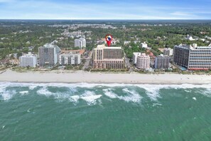 An aerial view of a coastal city with multiple high-rise hotels, a beach, and a view of the ocean. - Caravelle 201-1BR- Indoor/Outdoor Pools, Hot Tub (Myrtle Beach)