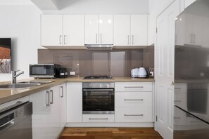 Apartment | Private kitchen | Fridge, coffee/tea maker, electric kettle, toaster - Elegant 3-bed Townhouse in Leafy Kensington (Melbourne)