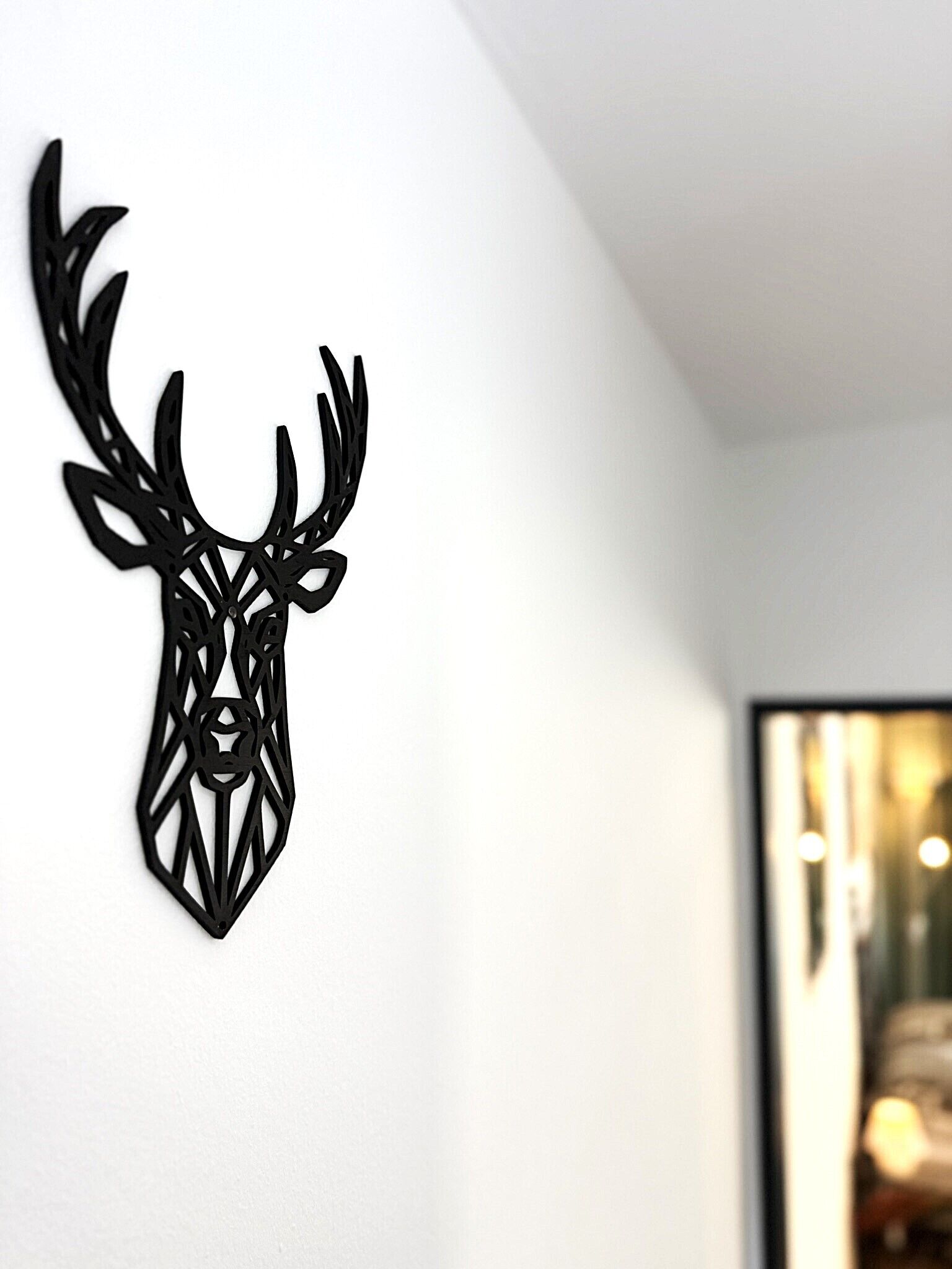 A wall-mounted deer head decoration.
