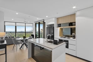 Apartment | Private kitchen - Modern City Escape With Pool Access and Views (Brisbane)