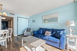 TV, books - Beachfront Condo with Balcony and Resort Pools (North Myrtle Beach)