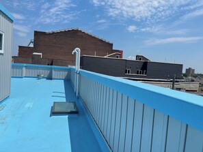 A rooftop with a blue railing, a skylight, and a metal vent. - P2E.Near center city 2 bedrooms 2 bathrooms entire apartment (Philadelphia)