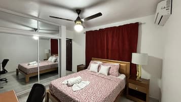 Desk, laptop workspace, blackout curtains, iron/ironing board