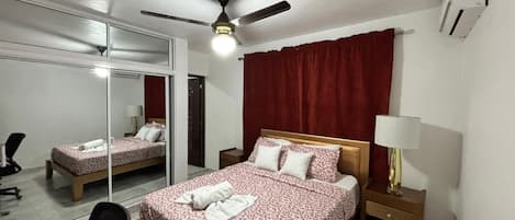 Desk, laptop workspace, blackout curtains, iron/ironing board