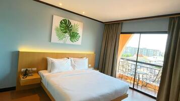 Superior Studio Suite, City View | Free minibar, desk, laptop workspace, bed sheets