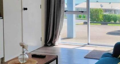 Modern family friendly apartment near the sea.