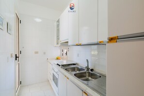 Fridge, oven, cookware/dishes/utensils, dining tables - Coral by Vivimy real estate (Gallipoli)