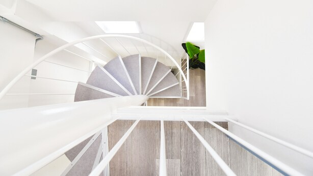 A spiral staircase with a white railing, leading upwards in a modern interior. - 1 minute to Universal Studios Japan! Spend a relaxing time in a stylish house with free parking! (Osaka city Konohana-ku Shimaya)