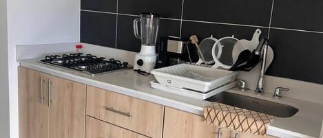 Fridge, microwave, stovetop, coffee/tea maker