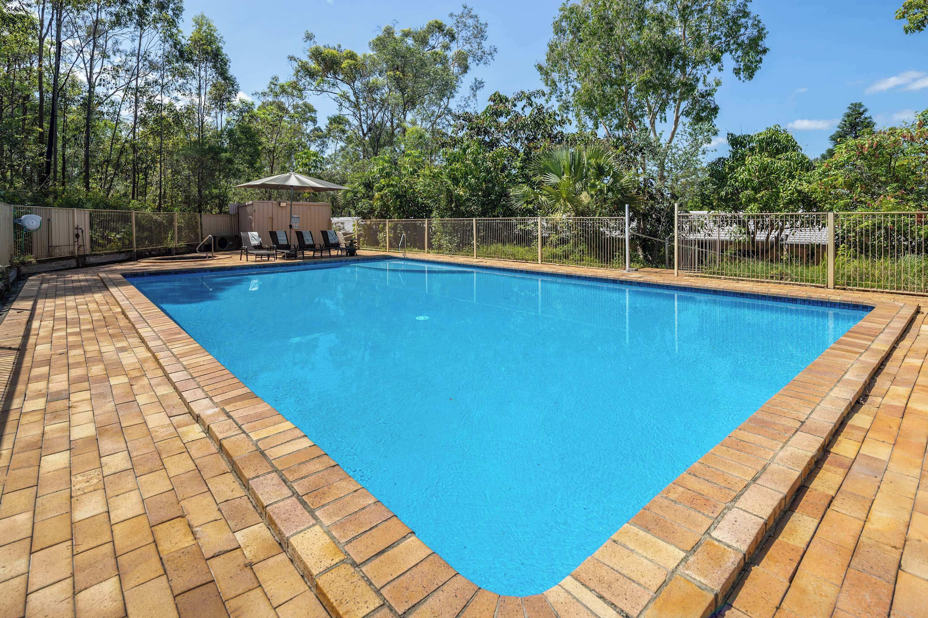 Outdoor pool (unheated) with spa and sun loungers. 
GRANDER® revitalised water.