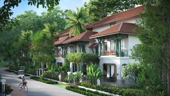 A row of traditional-style villas with red-tiled roofs, surrounded by lush greenery and palm trees. - Green Villas Tropical Phu Quoc (Phu Quoc)