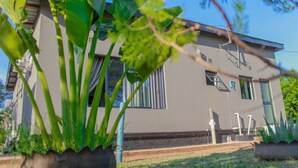 A modern building with large windows and a flat roof. - Tou Safari Lodge (Livingstone)
