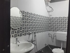 Basic Double Room, City View | Bathroom | Shower, free toiletries, towels, soap - Hotel Holiday Era Lodging (Chhatrapati Sambhajinagar)