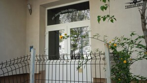 A building with a sign reading '3 Baneasa Airport' and a window with a name plaque. - 3 Baneasa Airport (Bucharest)