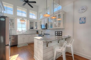 Fridge, microwave, oven, stovetop - Experience the perfect beach getaway at Elysium Breeze, Oak Island, NC, with 3 bedrooms. (Oak Island)