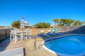 A heated pool - Experience the perfect beach getaway at Elysium Breeze, Oak Island, NC, with 3 bedrooms. (Oak Island)