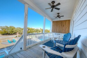 Terrace/patio - Experience the perfect beach getaway at Elysium Breeze, Oak Island, NC, with 3 bedrooms. (Oak Island)