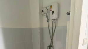 A small bathroom with a toilet, a shower unit, and a sink. - PPplace Mahidol (Chiang Mai)