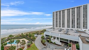 A high-rise hotel with a pool, beach view, and a parking area. - S Hampton 1406 2 Br Oceanview in Kingston, Pool (Myrtle Beach)