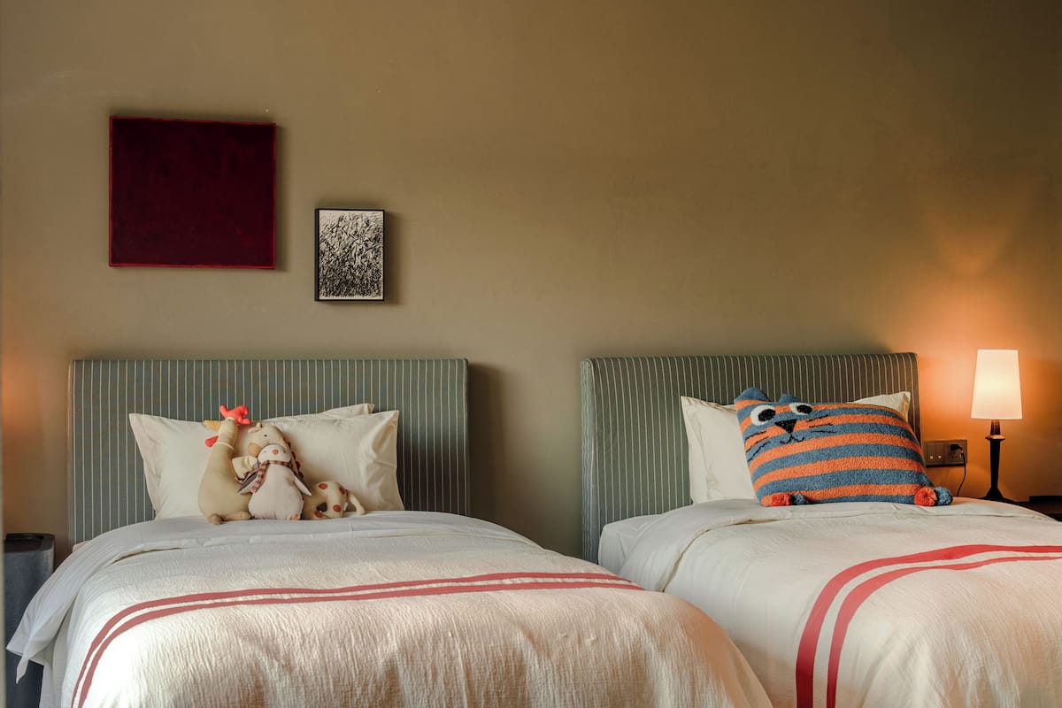 Family Suite, City View | Desk, laptop workspace, blackout curtains, iron/ironing board