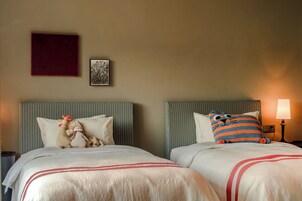 Family Suite, City View | Desk, laptop workspace, blackout drapes, iron/ironing board