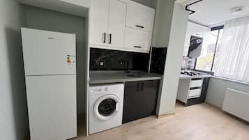 Classic Apartment, City View | Private kitchen | Mini-fridge, stovetop, cookware/dishes/utensils