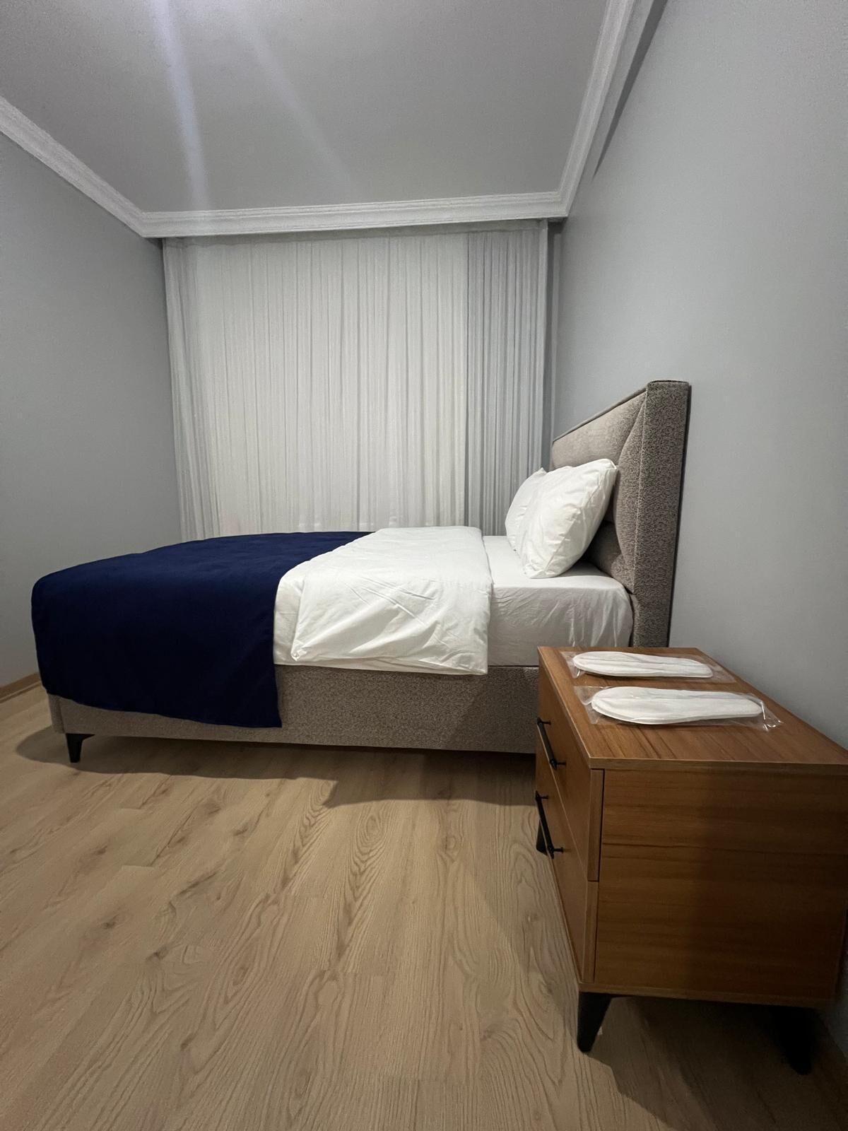 Premium bedding, laptop workspace, iron/ironing board, bed sheets