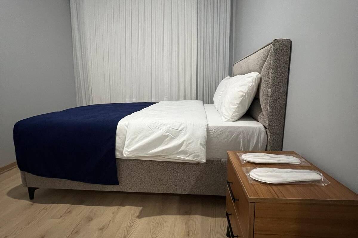 Premium bedding, laptop workspace, iron/ironing board, bed sheets
